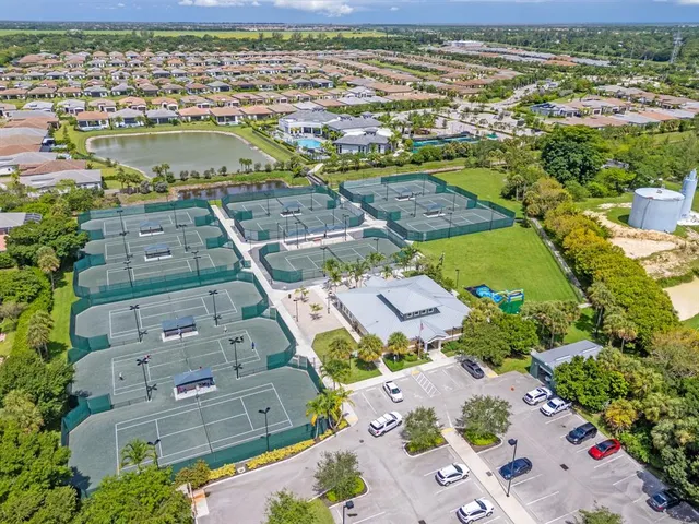 an aerial view of ocean with residential house with outdoor space
