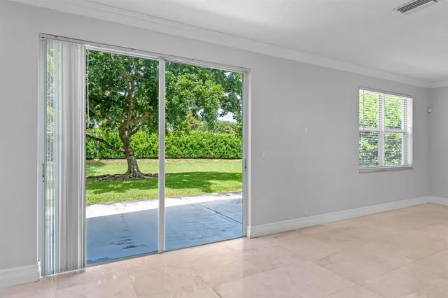 a view of an empty room and window