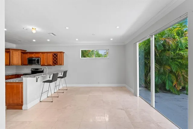 a view of a kitchen with furniture and staircase