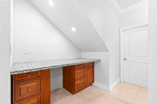 a kitchen with granite countertop cabinets and sink