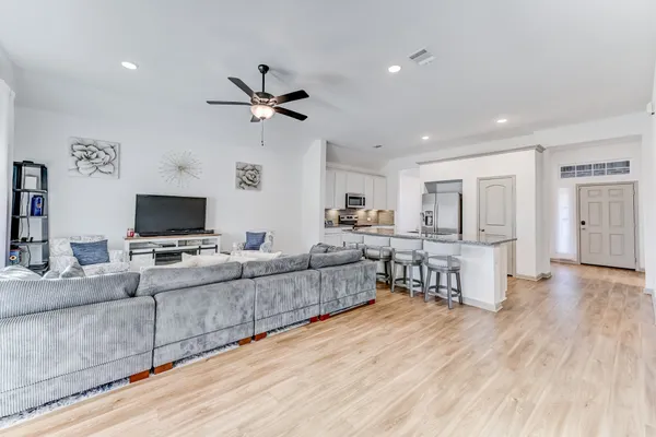 a living room with furniture and a flat screen tv