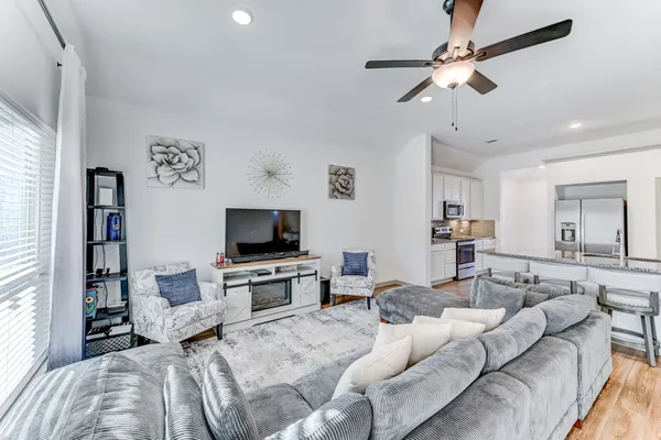 a living room with furniture and a flat screen tv