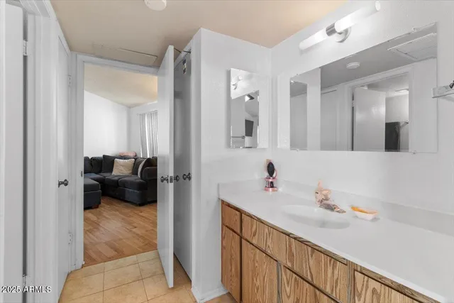 a view of a workspace with furniture and wooden floor