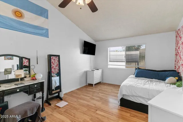 a en suite bathroom with a double vanity sink and a mirror