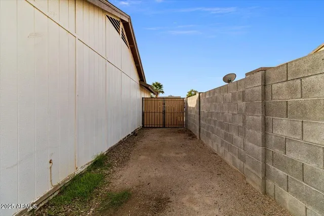 a view of a house with backyard and porch