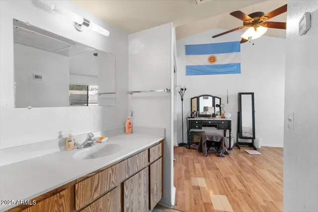 a kitchen with a sink a refrigerator and a stove