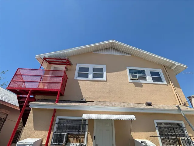 a blue and white building with a large window