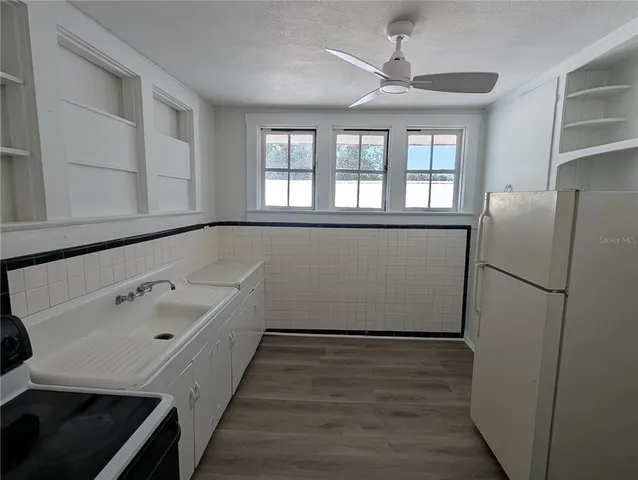 a hallway with sliding door and front door