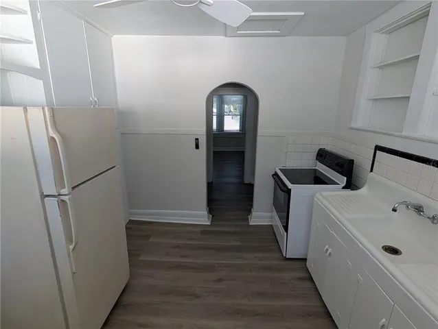 a view of a hallway with washer and dryer