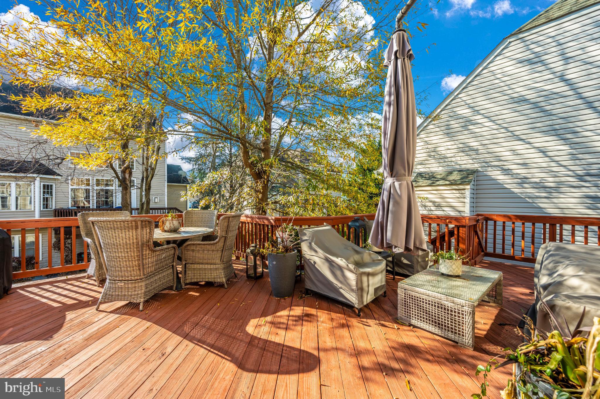 2575 Bear Den Road Frederick, MD 21701 - Photo 16 of 38 Sunny deck retreat with vibrant foliage.