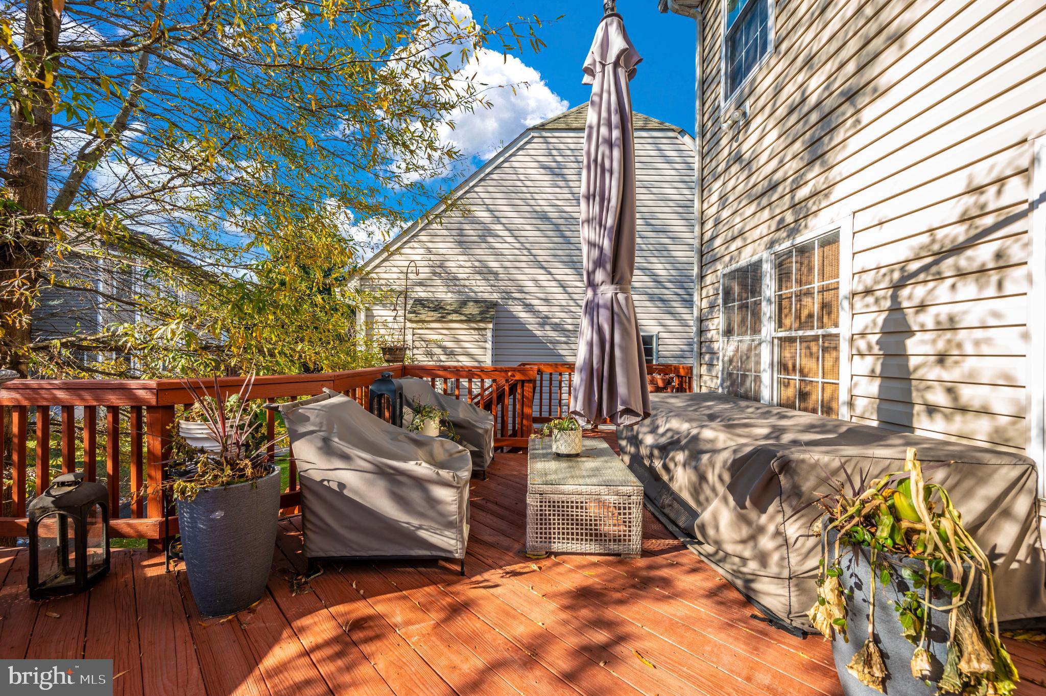 2575 Bear Den Road Frederick, MD 21701 - Photo 17 of 38 Sunny deck retreat with lush greenery.