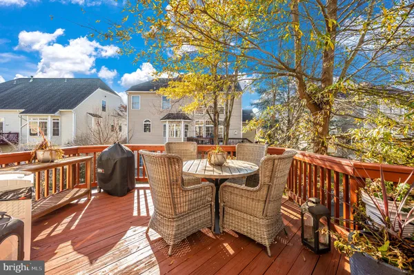 a view of a patio with iron fence