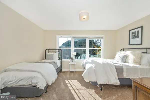 a bed room with a bed and a window