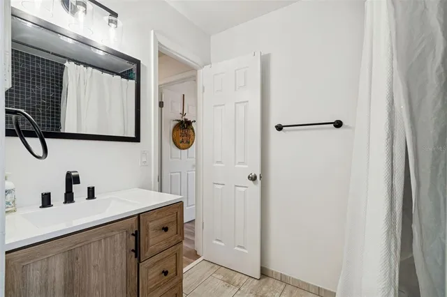 a bathroom with a sink and a mirror