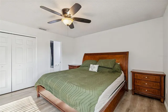 a bedroom with a bed and a closet