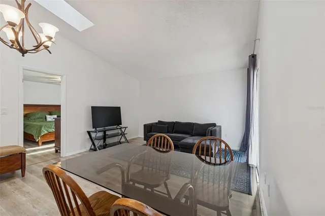 a view of a livingroom with furniture and a flat screen tv