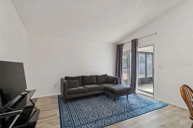 a living room with furniture and a rug