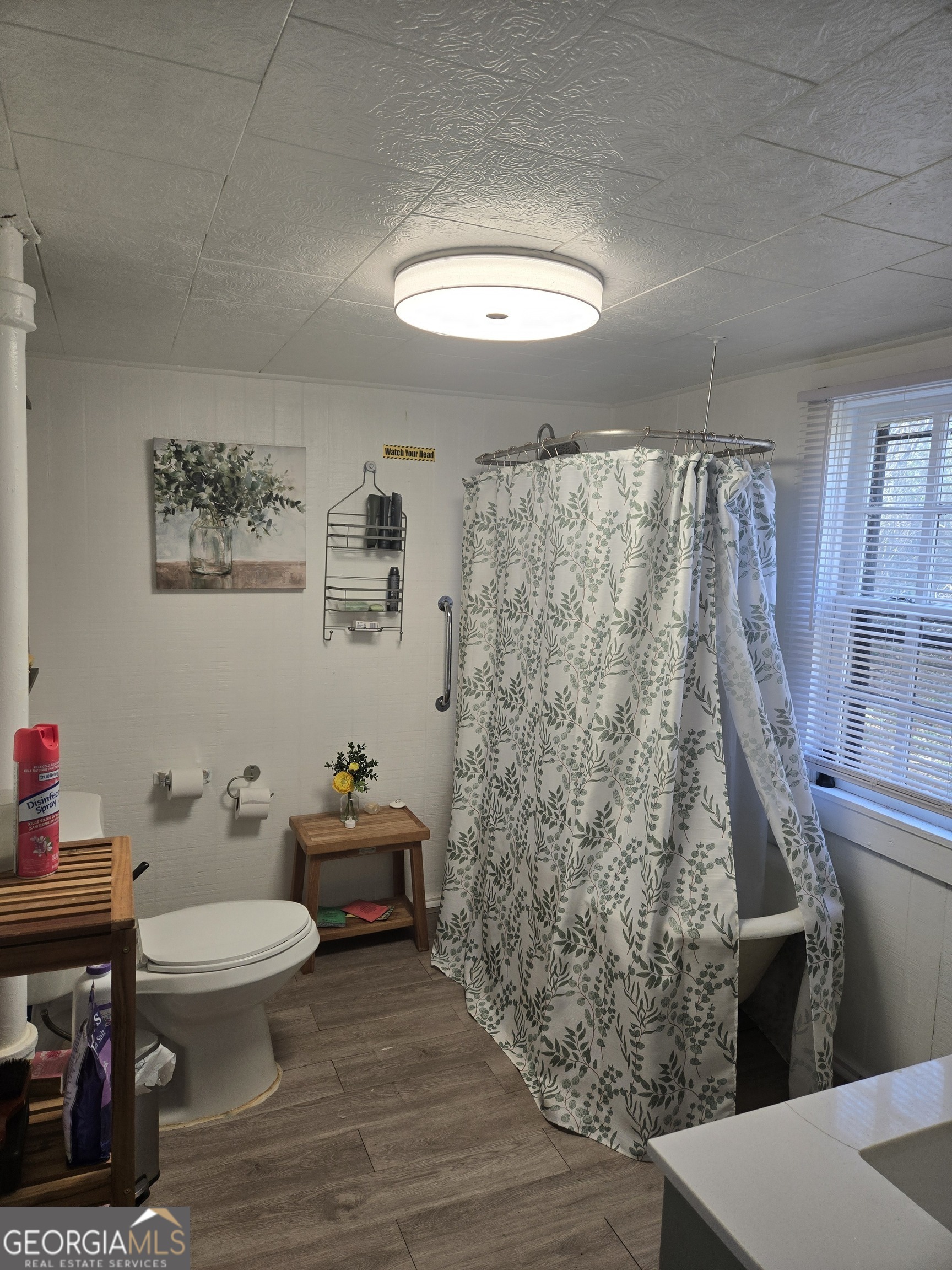 904 Park Avenue LaGrange, GA 30240 - Photo 6 of 11 a bathroom with a toilet a sink and a mirror