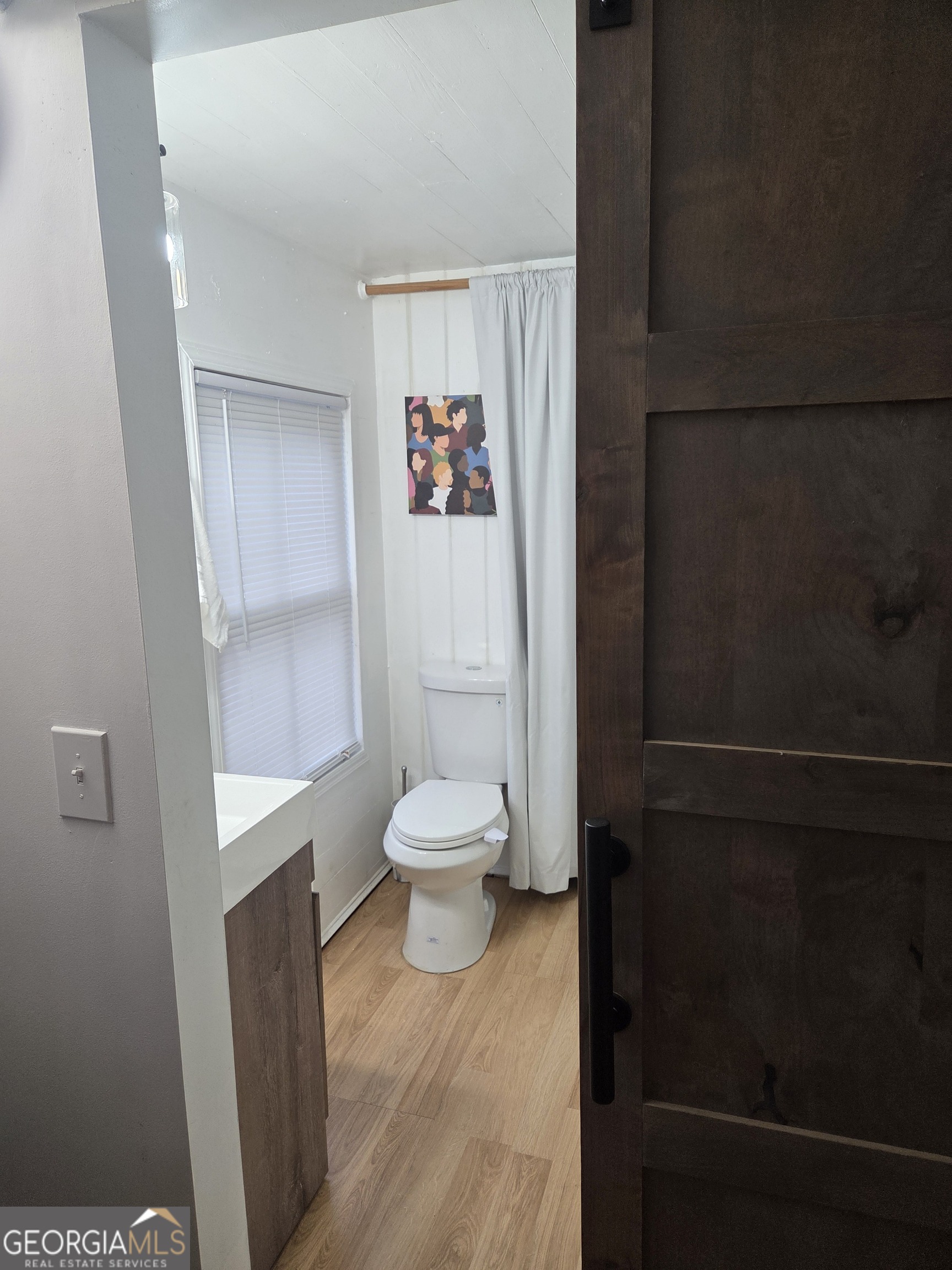 904 Park Avenue LaGrange, GA 30240 - Photo 8 of 11 a white toilet sitting next to a bathroom sink