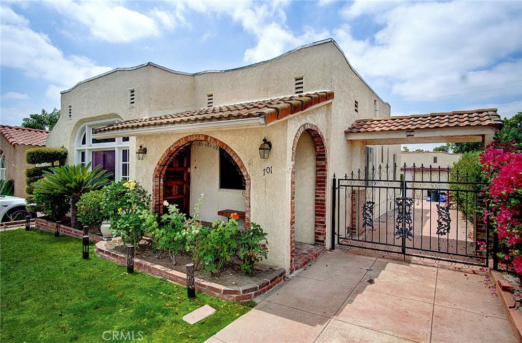 701 Westminster Avenue Alhambra, CA 91803 - Photo 1 of 35 a front view of a house with garden