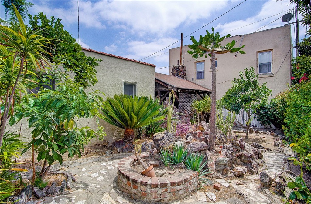 701 Westminster Avenue Alhambra, CA 91803 - Photo 20 of 35 a potted plant sitting in front of a house