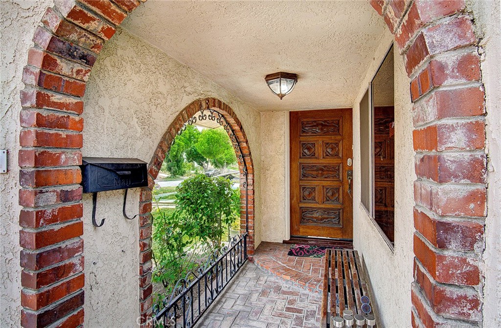 701 Westminster Avenue Alhambra, CA 91803 - Photo 2 of 35 a view of an entryway with a floor to ceiling window
