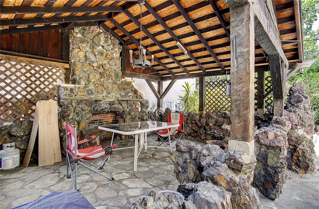 701 Westminster Avenue Alhambra, CA 91803 - Photo 23 of 35 a backyard of a house with table and chairs
