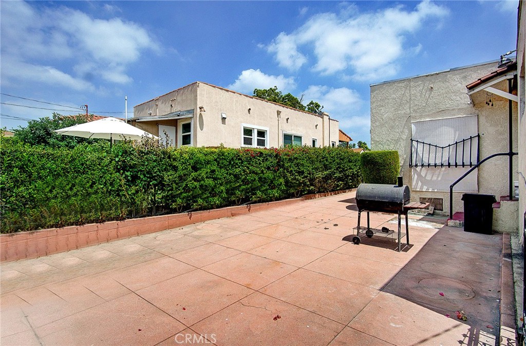 701 Westminster Avenue Alhambra, CA 91803 - Photo 25 of 35 a view of a patio with a table and chairs