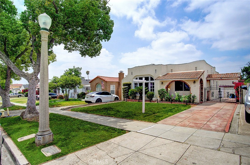 701 Westminster Avenue Alhambra, CA 91803 - Photo 3 of 35 a front view of a house with garden