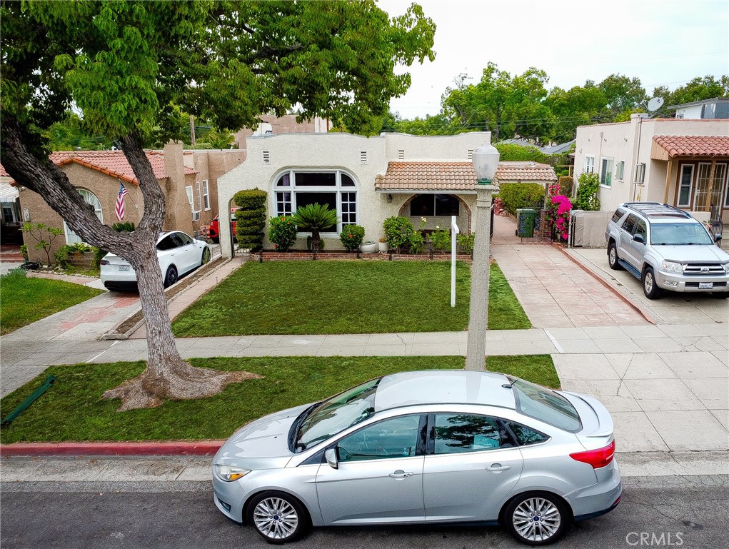 701 Westminster Avenue Alhambra, CA 91803 - Photo 35 of 35 a front view of a house with a garden and parking