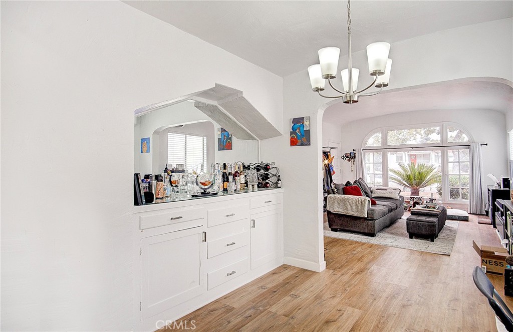 701 Westminster Avenue Alhambra, CA 91803 - Photo 8 of 35 a view of a livingroom with furniture cabinet and wooden floor