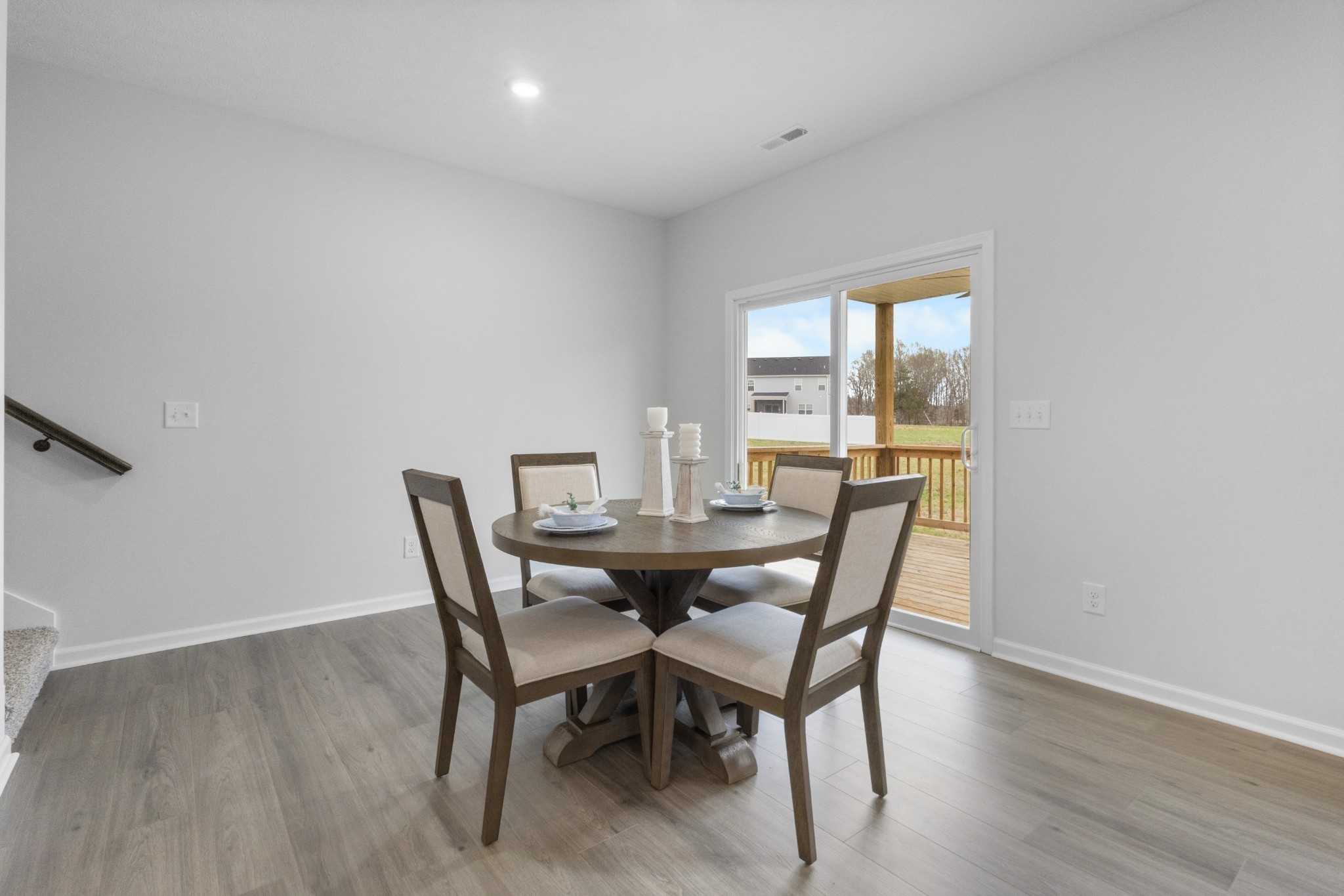 1192 Boulder Pass Road Clarksville, TN 37040 - Photo 16 of 26 a view of a dining room with furniture and wooden floor