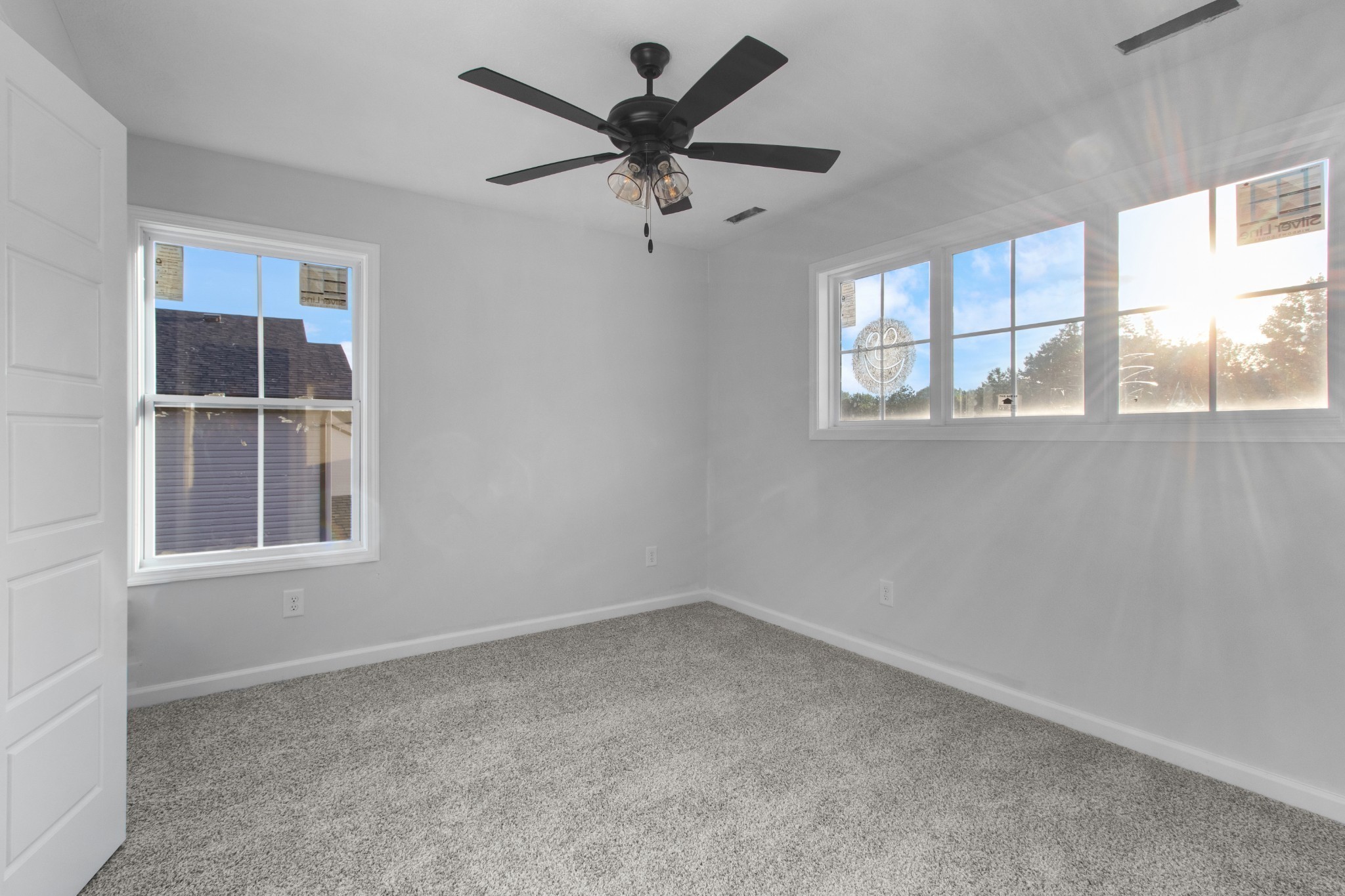 1192 Boulder Pass Road Clarksville, TN 37040 - Photo 20 of 26 an empty room with windows and fan