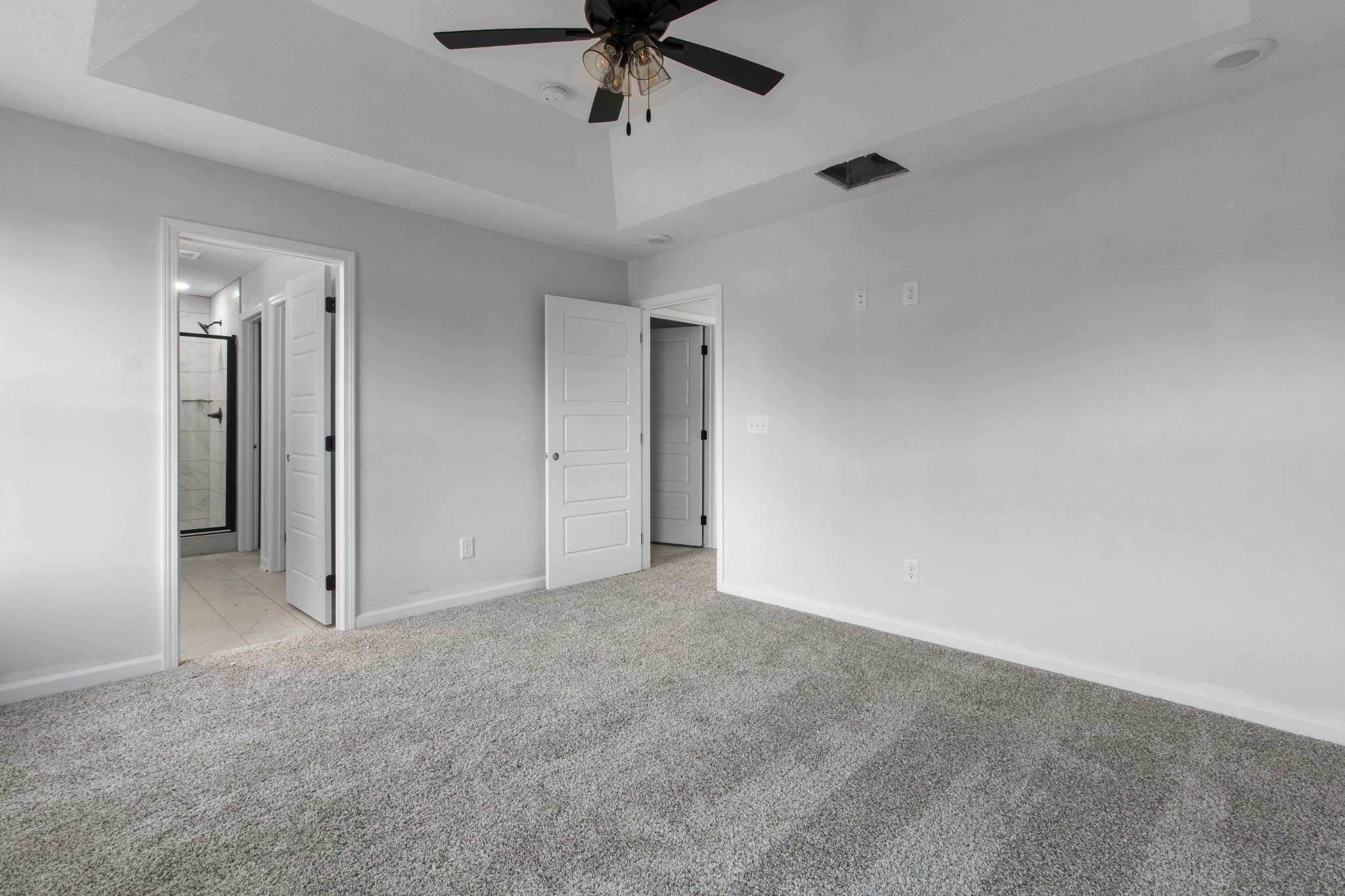 1192 Boulder Pass Road Clarksville, TN 37040 - Photo 22 of 26 an empty room with a ceiling fan and carpet