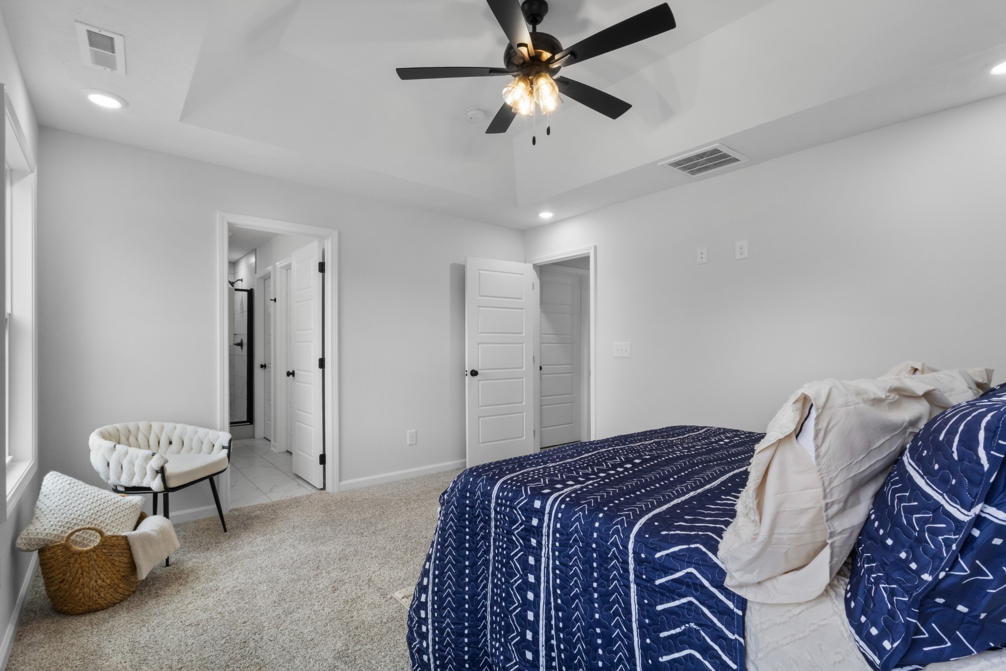 1192 Boulder Pass Road Clarksville, TN 37040 - Photo 24 of 26 a bedroom with a bed and a chandelier