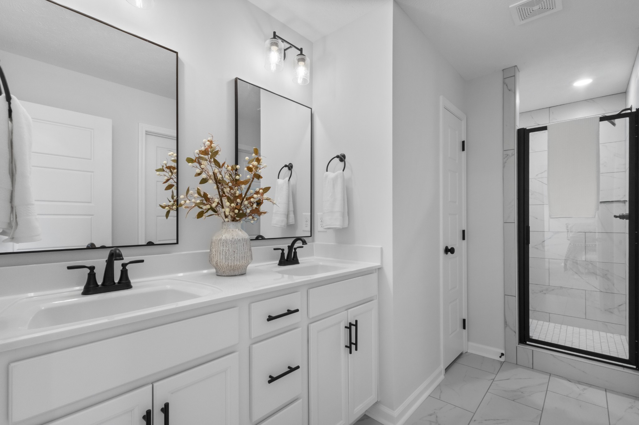 1192 Boulder Pass Road Clarksville, TN 37040 - Photo 25 of 26 a bathroom with a double vanity sink and mirror