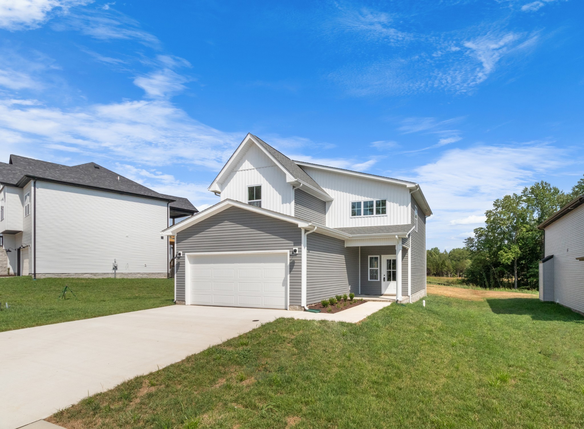 1192 Boulder Pass Road Clarksville, TN 37040 - Photo 5 of 26 a front view of a house with a garden and yard