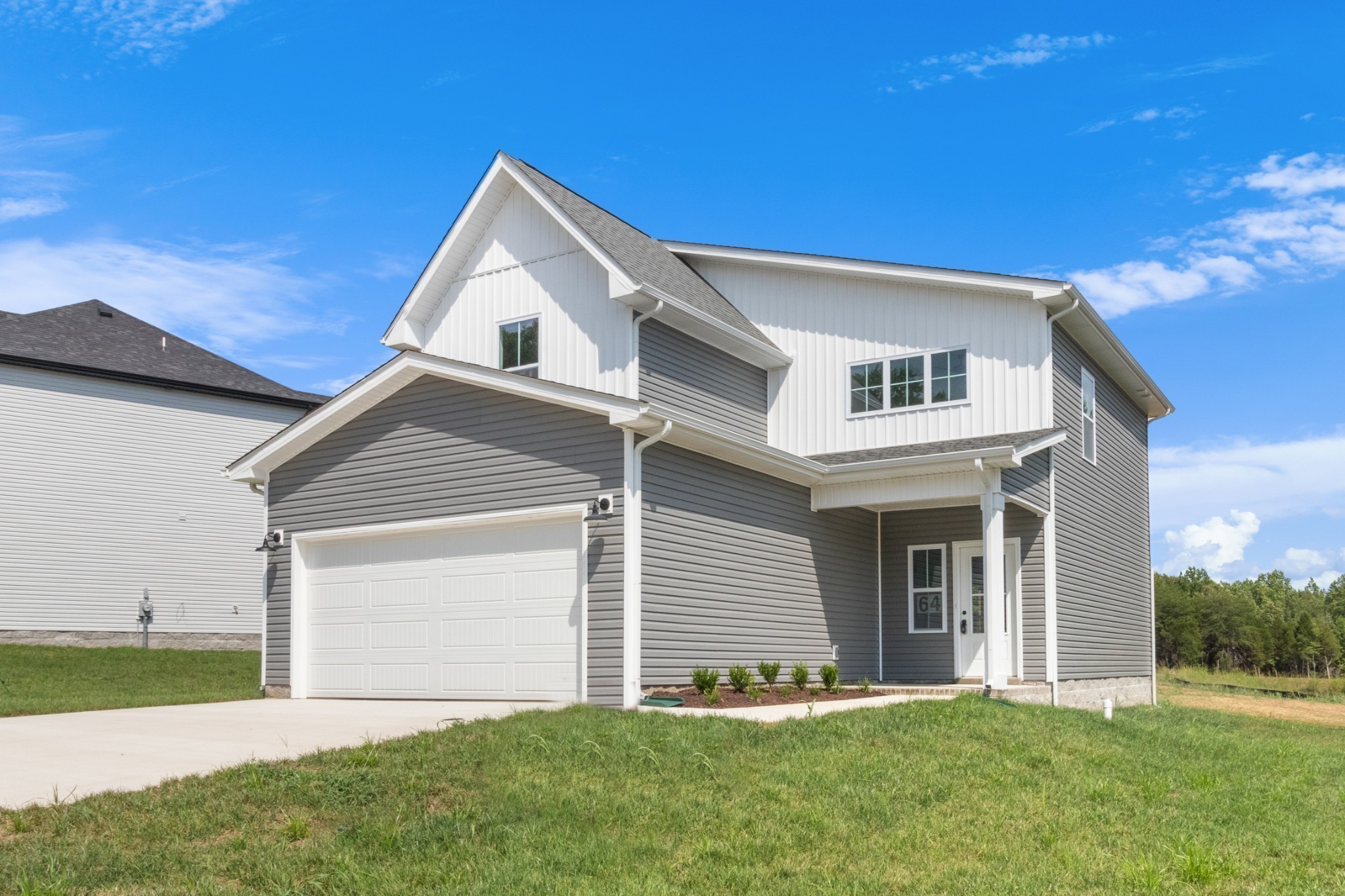 1192 Boulder Pass Road Clarksville, TN 37040 - Photo 6 of 26 a front view of a house with a yard and garage