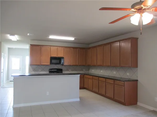 a kitchen with granite countertop a cabinets and a sink