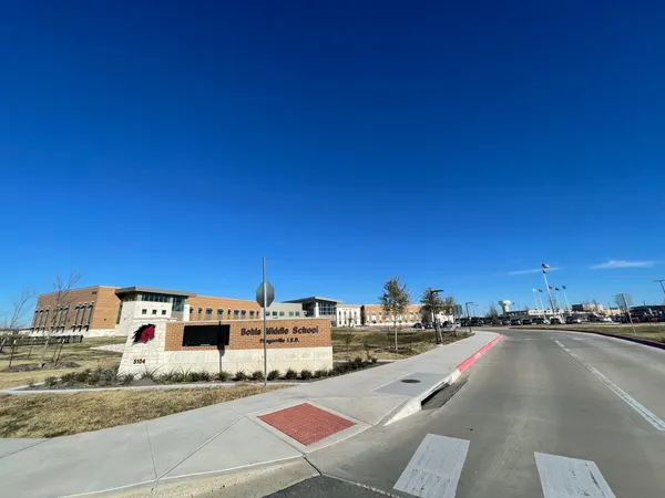 a view of a building with traffic signal