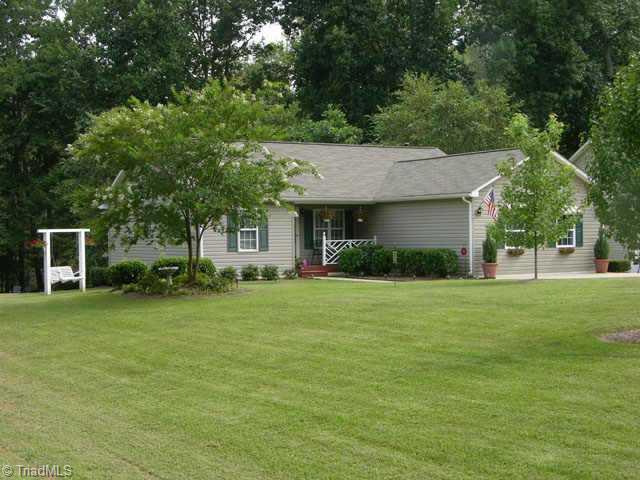 8111 Bartonshire Drive Oak Ridge, NC 27310 - Photo 1 of 6 Exterior Front.