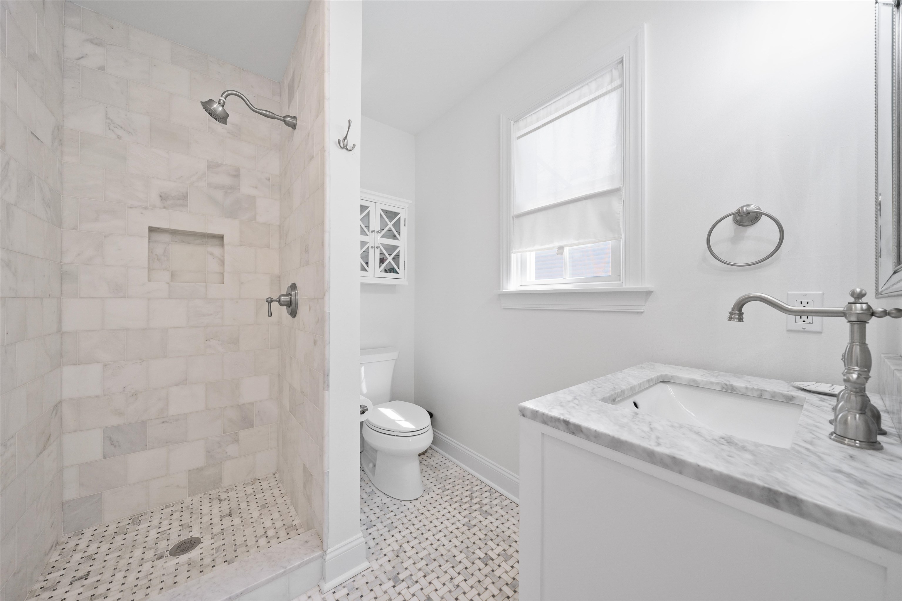 360 39th Street, Unit EAST Avalon, NJ 08202 - Photo 12 of 28 a bathroom with a sink toilet a shower and a mirror