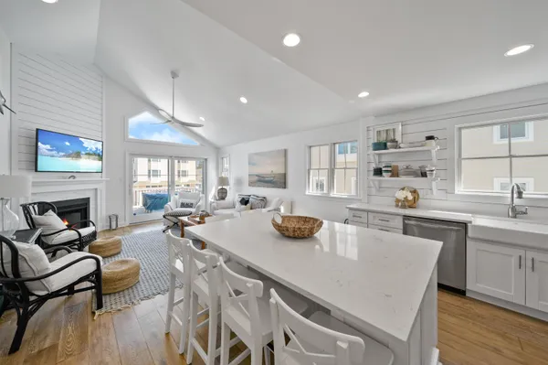 a kitchen with stainless steel appliances a sink stove and cabinets