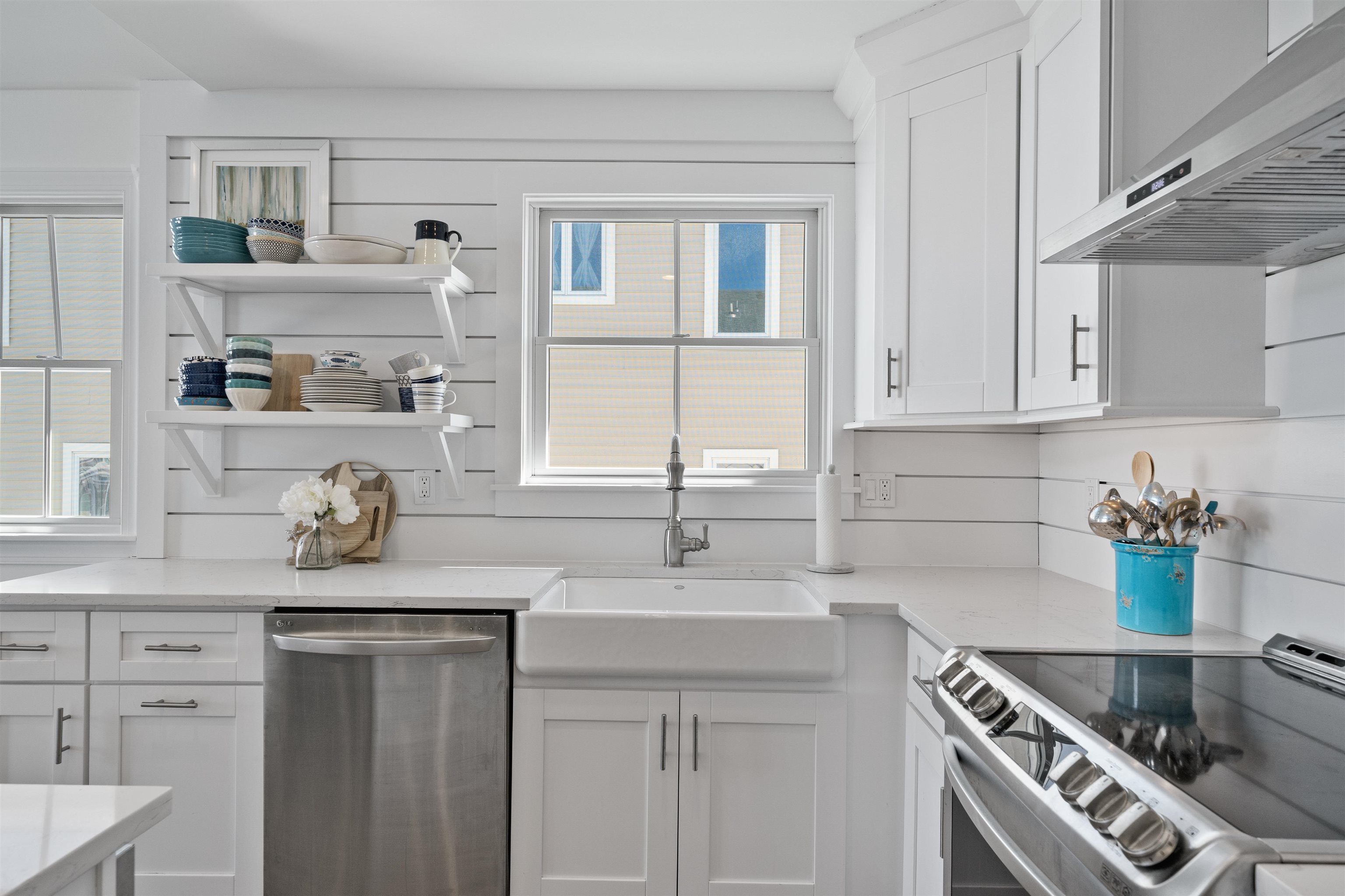 360 39th Street, Unit EAST Avalon, NJ 08202 - Photo 8 of 28 a kitchen with stainless steel appliances a sink stove and cabinets