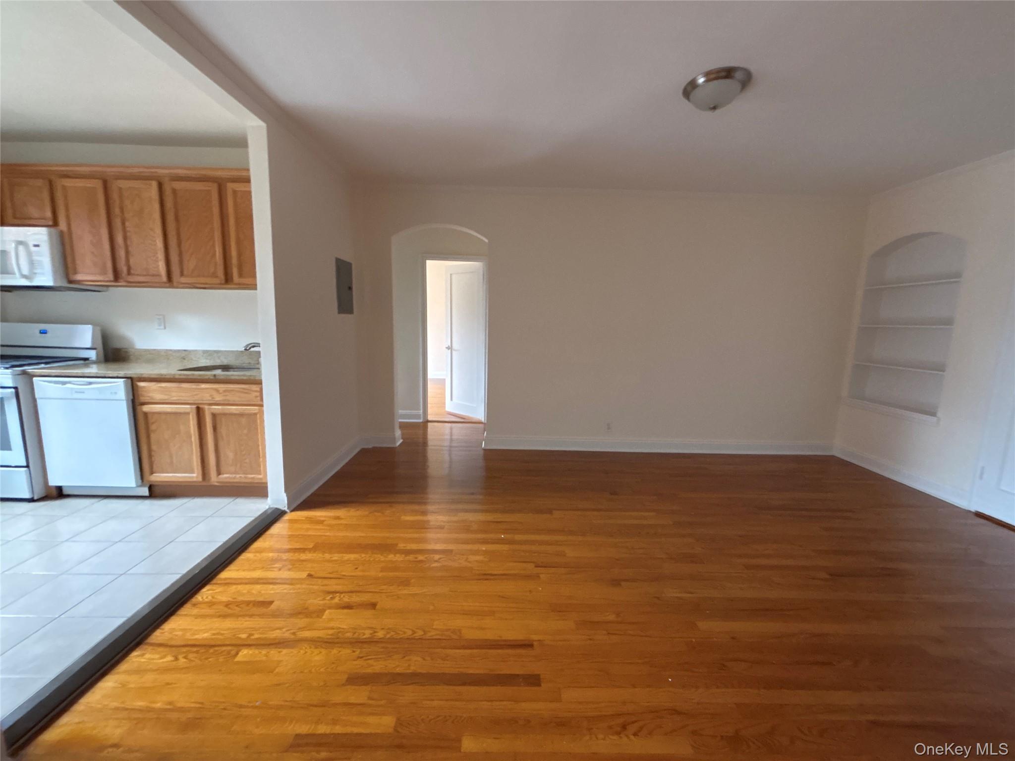 160 South Middle Neck Road, Unit 3C Great Neck, NY 11021 - Photo 7 of 19 a view of a kitchen with wooden floor and a sink
