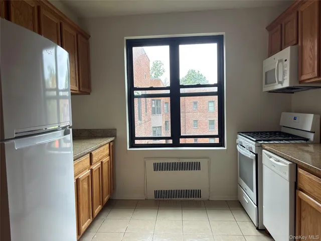 a kitchen with stainless steel appliances a refrigerator and a stove