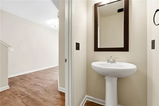 a bathroom with a sink a mirror and shower