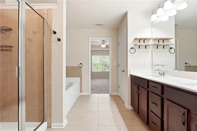 a bathroom with a double vanity sink and mirror with shower