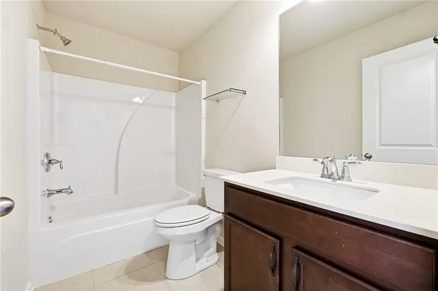 a bathroom with a sink a toilet and a bathtub