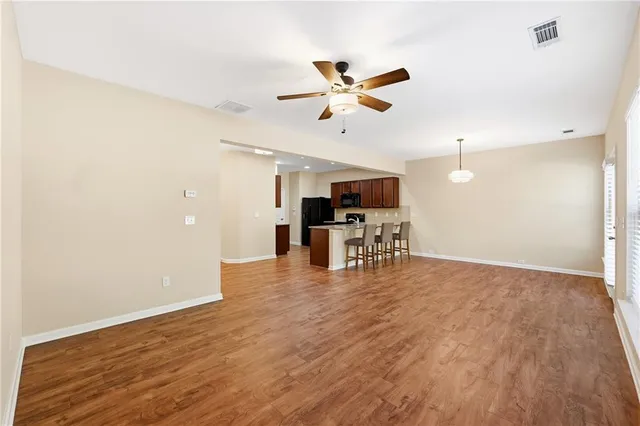 a view of kitchen with a sink and microwave